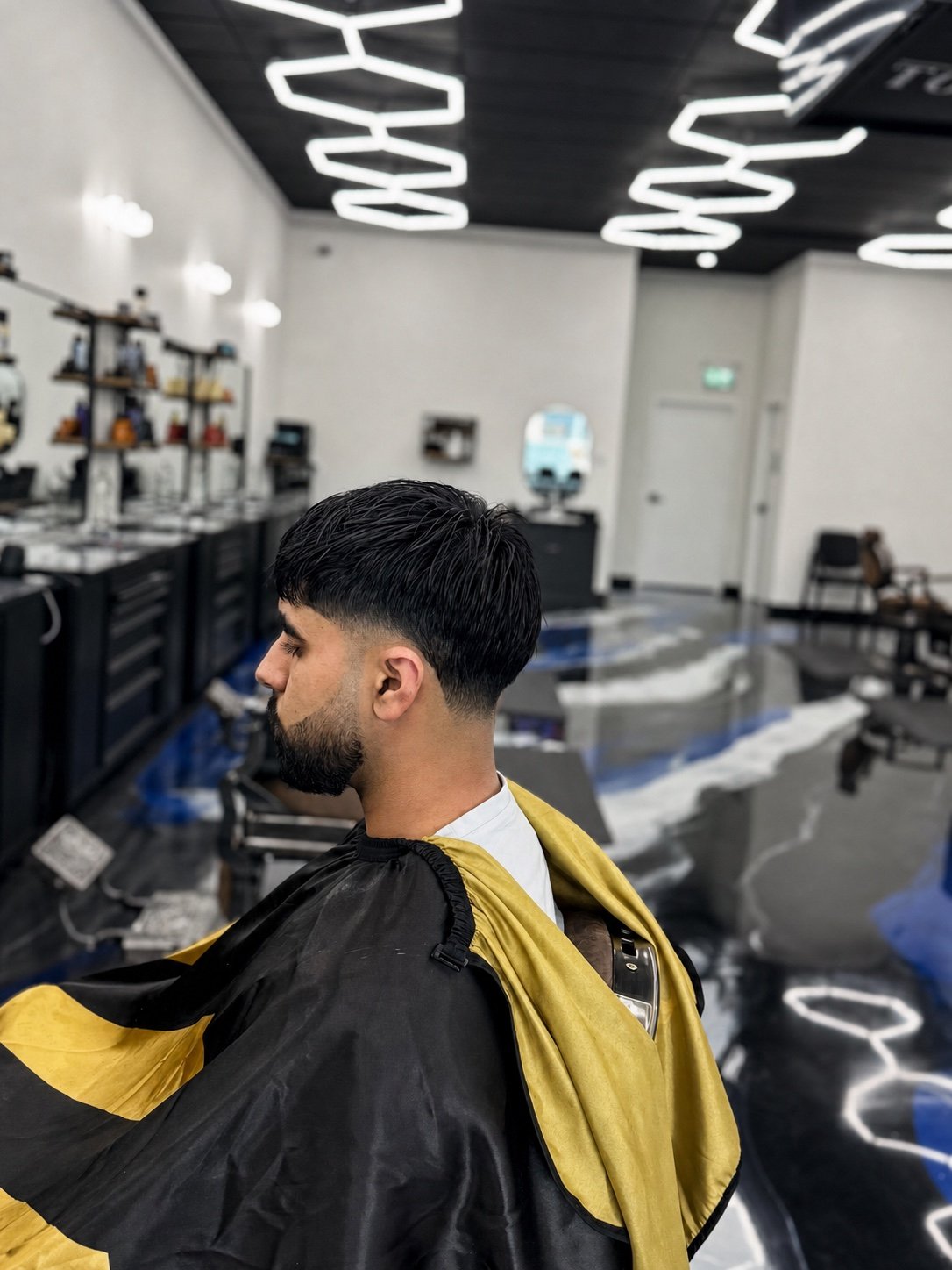 Clean beard line and tapered haircut completed at TopTown Barbershop