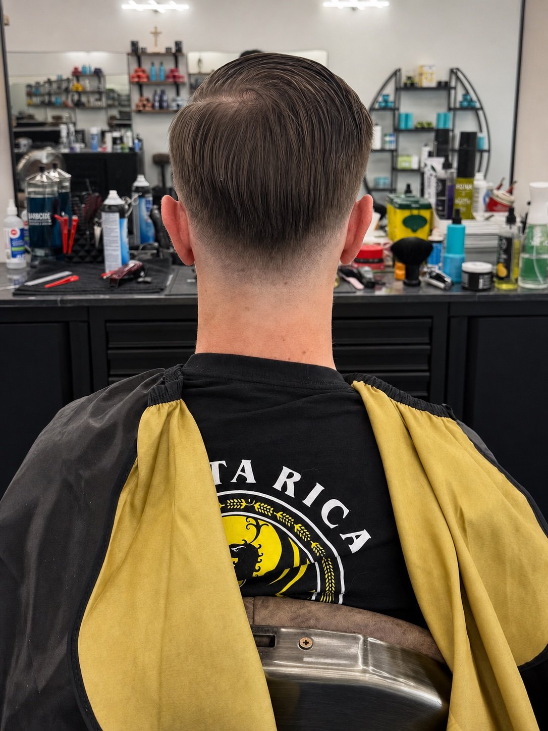 Clean tapered haircut completed at TopTown Barbershop