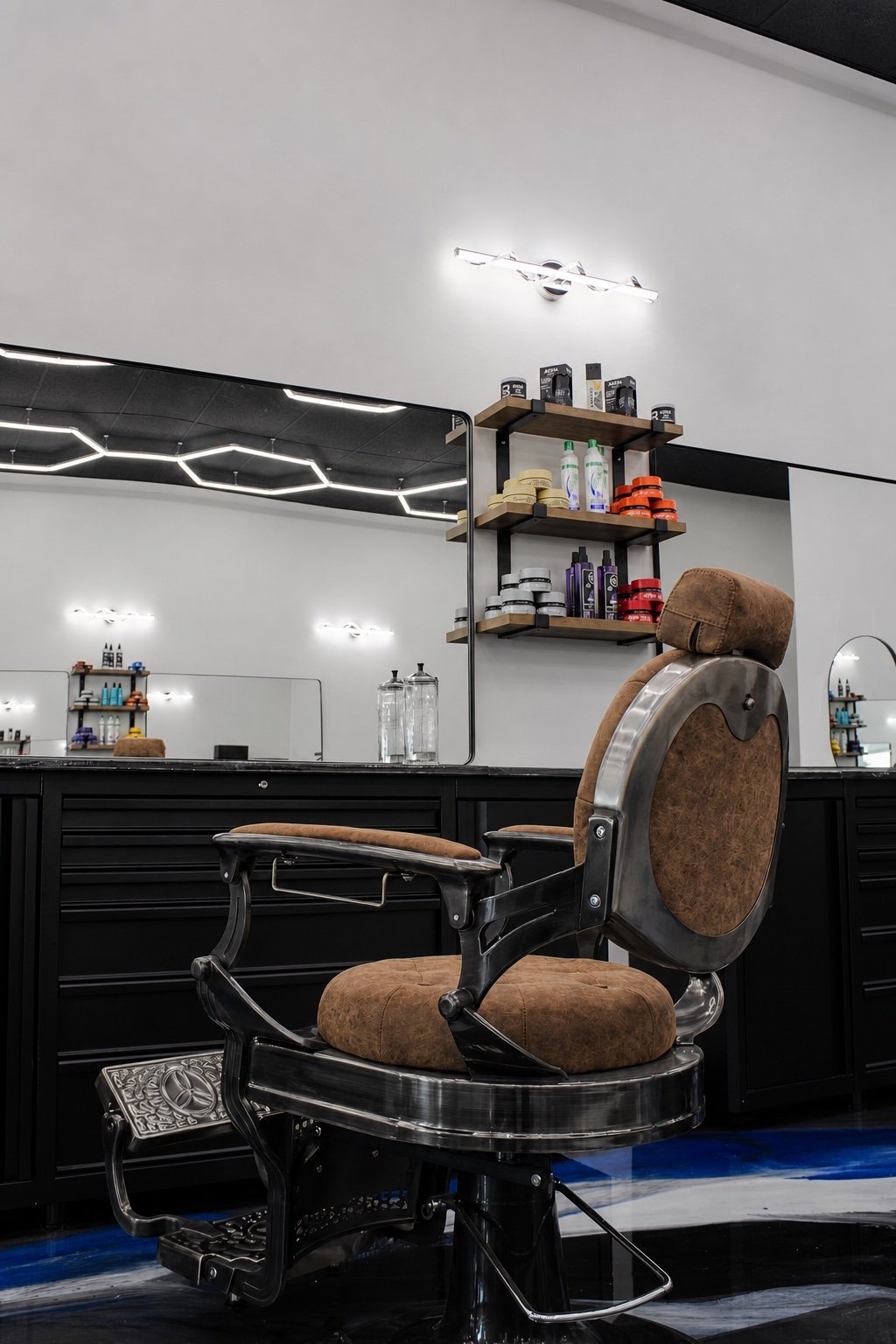 TopTown Barbershop signature chair in front of the finished workstation and product display
